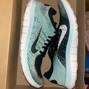 Blue and black Nike sneakers